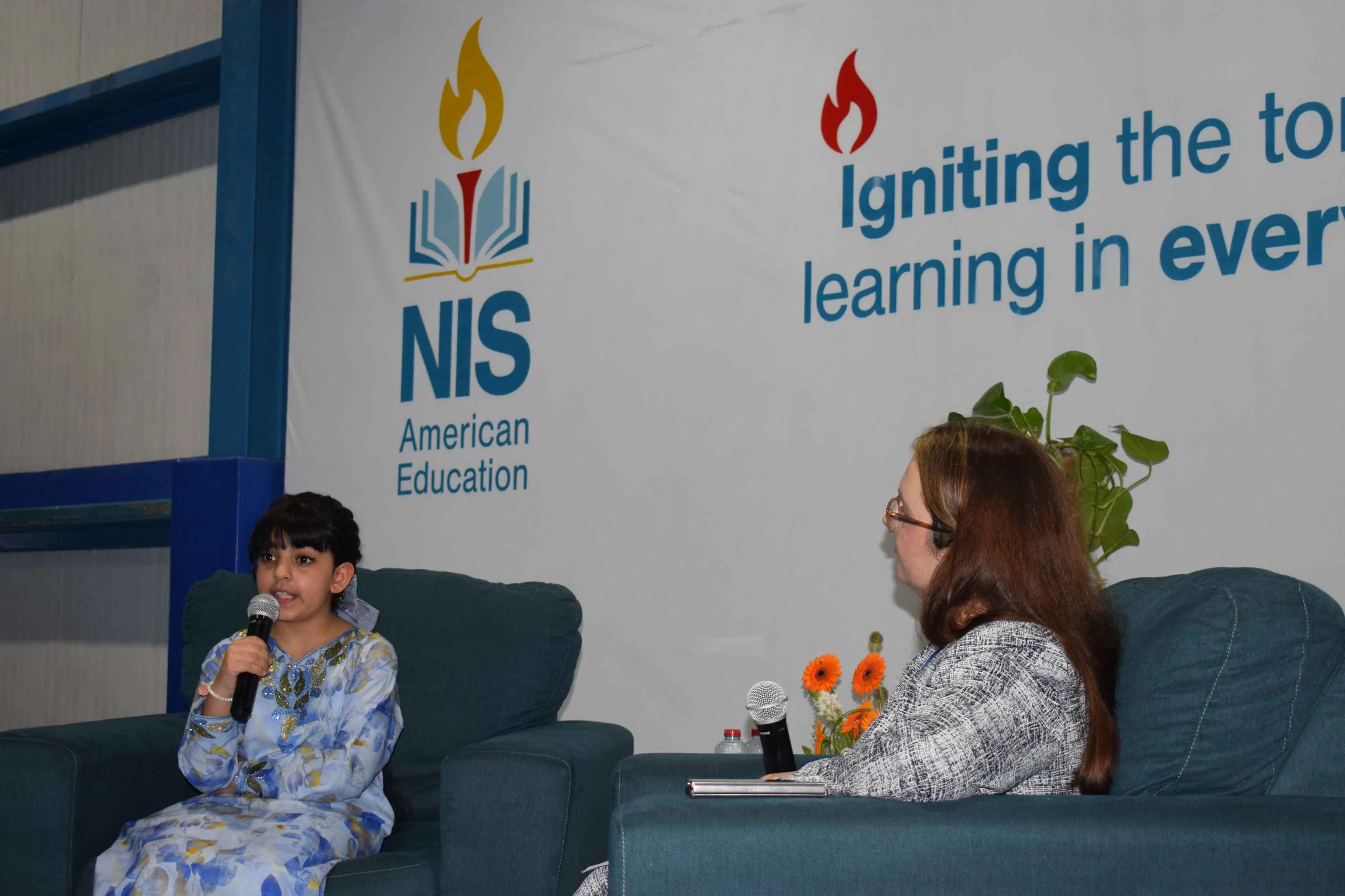 Youngest emirati entrepreneur and published author visits NIS to celebrate literacy