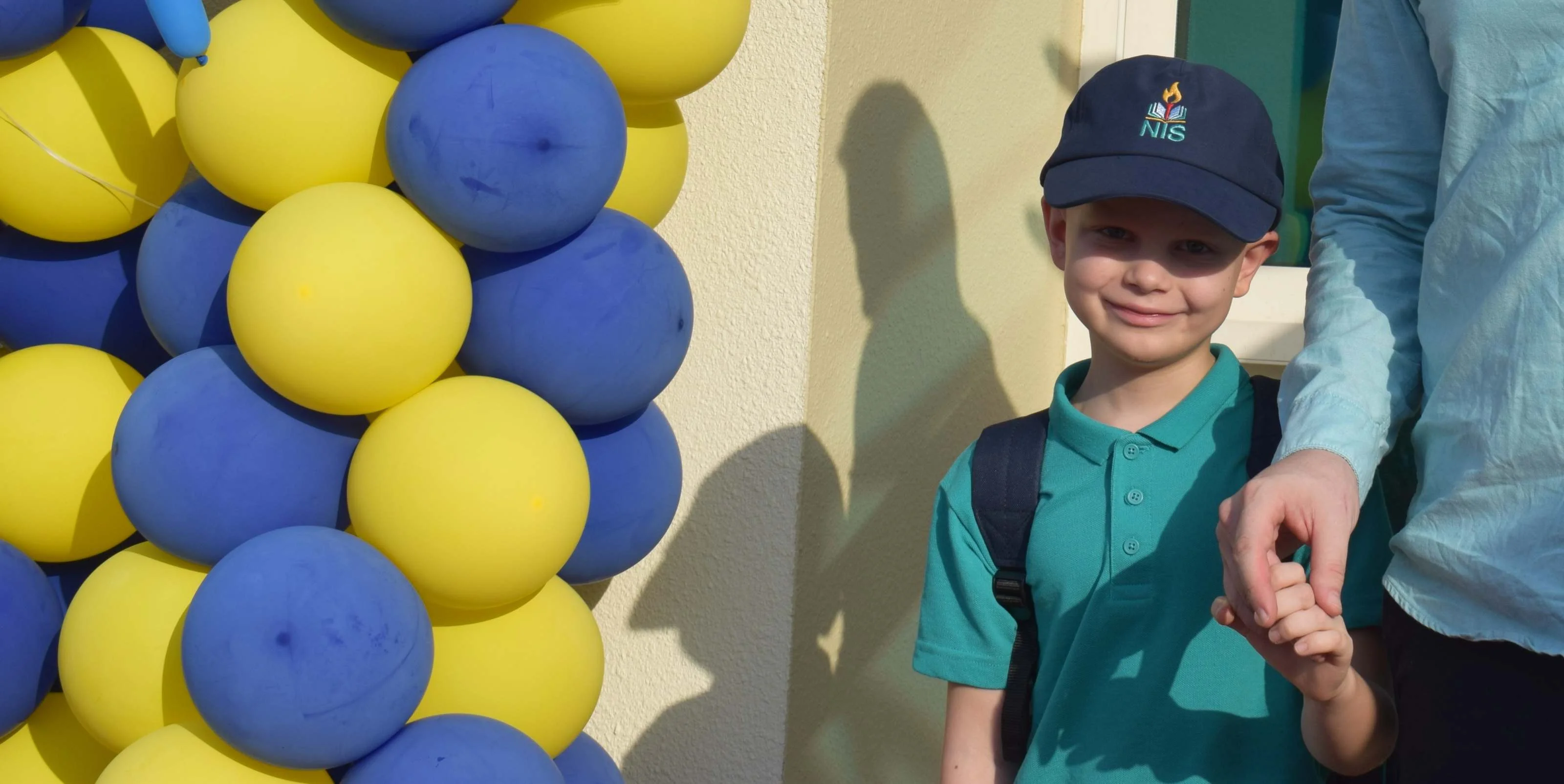 Big smiles and Warm Hugs: NIS community welcomes students back to school